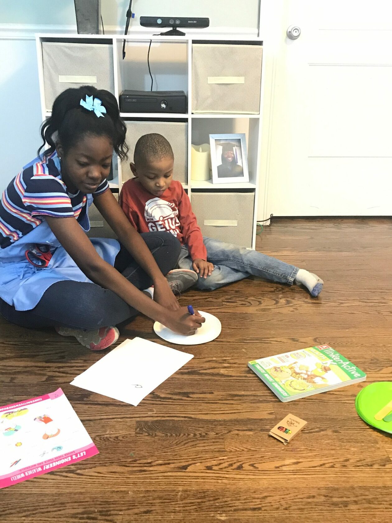 kids working in TinkerActive workbooks